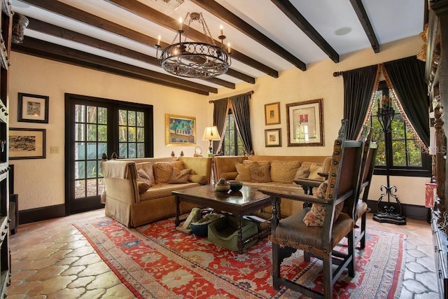 living room featuring plenty of natural light, baseboards, and beamed ceiling