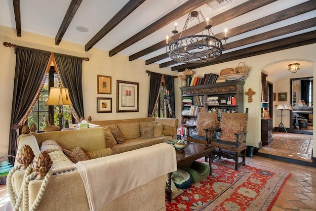 tiled living room with arched walkways, visible vents, beamed ceiling, and an inviting chandelier