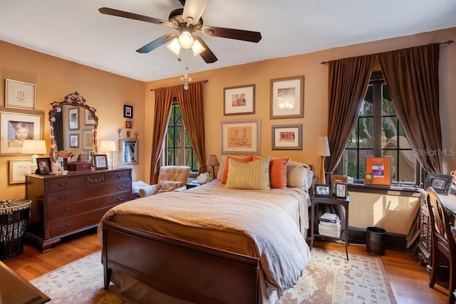 bedroom featuring ceiling fan and wood finished floors