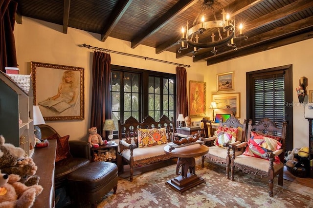 sitting room featuring wooden ceiling, a notable chandelier, and beamed ceiling