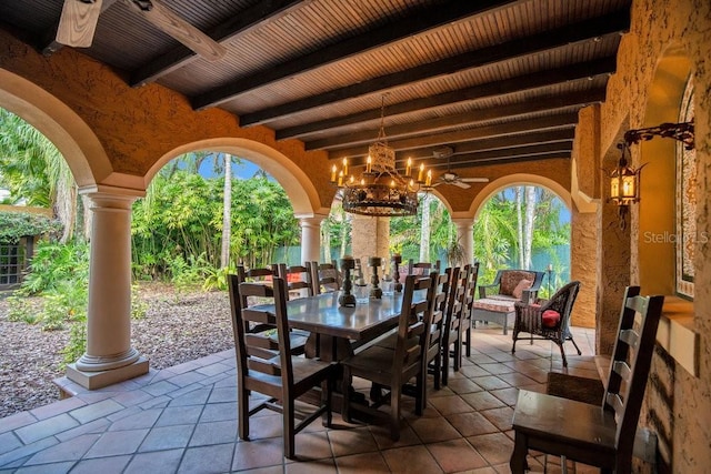 view of patio with outdoor dining area and a ceiling fan