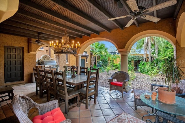 view of patio with outdoor dining space, ceiling fan, and area for grilling