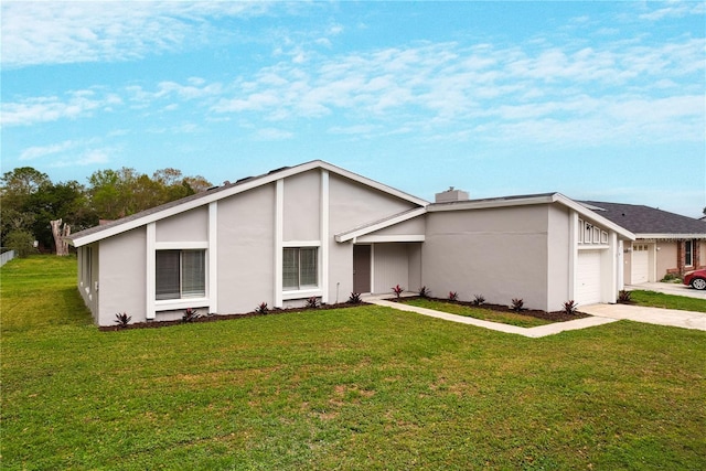 mid-century modern home with an attached garage, a front lawn, concrete driveway, and stucco siding