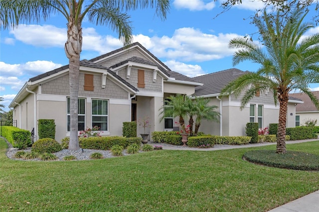 view of front of property with a front lawn and stucco siding