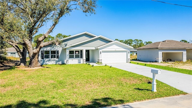 ranch-style house featuring an attached garage, concrete driveway, and a front yard