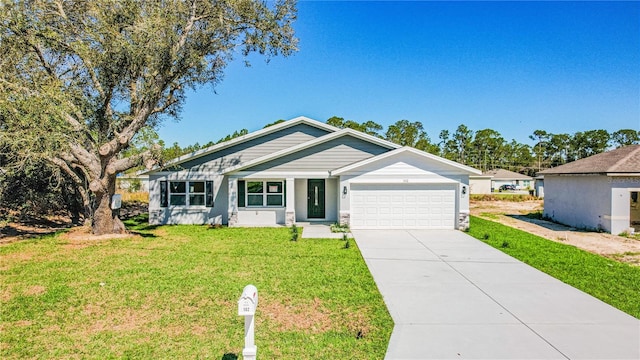 view of front of home featuring a garage, concrete driveway, and a front lawn