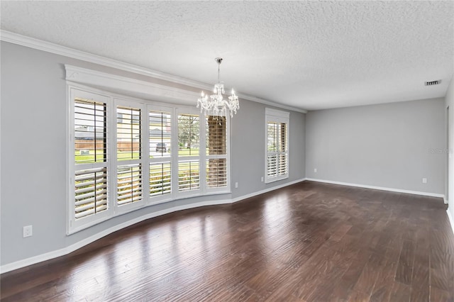 spare room featuring an inviting chandelier, baseboards, visible vents, and dark wood-type flooring