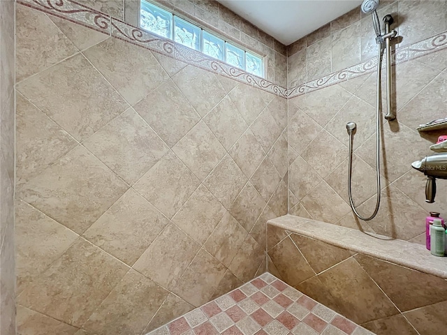 full bathroom with a tile shower