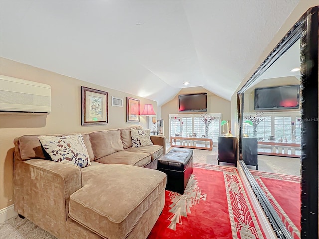 carpeted living area with vaulted ceiling, a wall mounted AC, plenty of natural light, and baseboards