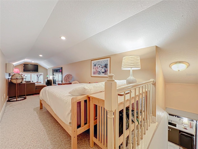 bedroom with recessed lighting, vaulted ceiling, and a textured ceiling