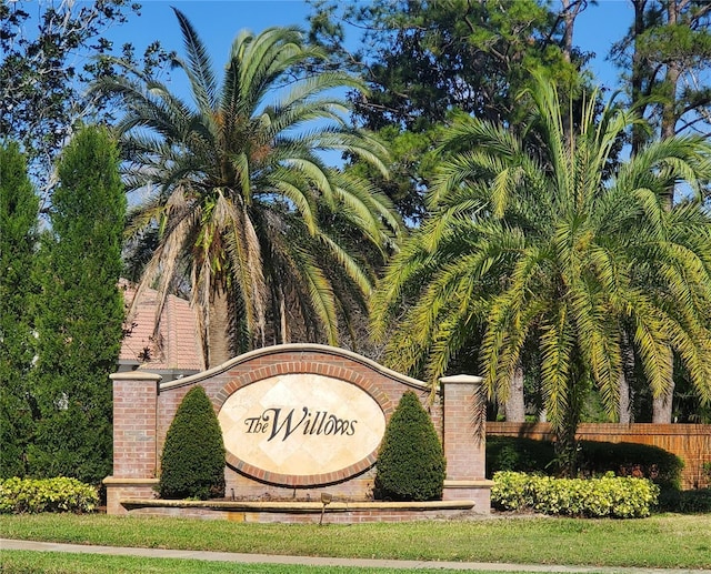 community sign featuring fence