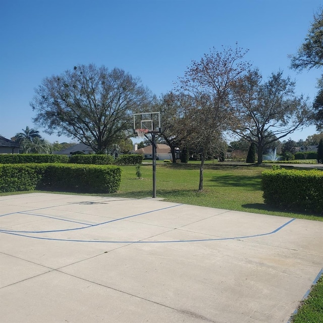 view of sport court with a yard and community basketball court