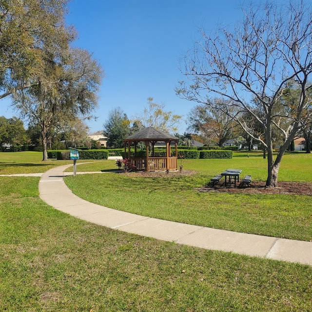 view of property's community featuring a lawn and a gazebo