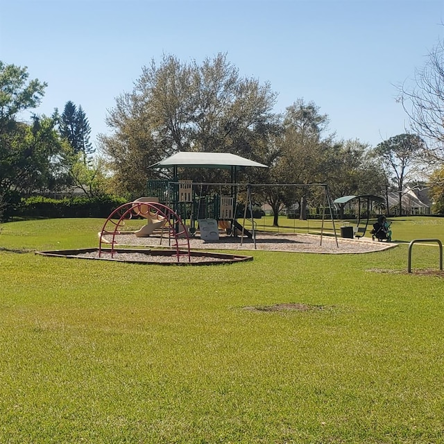 community jungle gym with a lawn