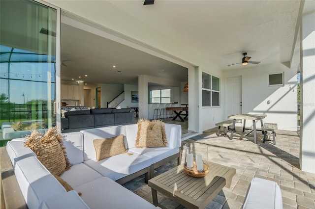 view of patio featuring ceiling fan and an outdoor hangout area