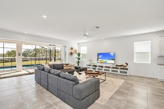 living area featuring light tile patterned floors, visible vents, and recessed lighting