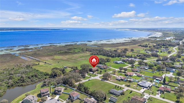 drone / aerial view featuring a water view and a residential view