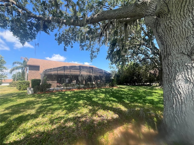 2825 Lake Tohopekaliga Blvd, Kissimmee, FL 34746 - view of yard featuring a lanai