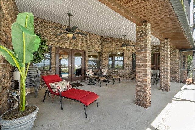 2825 Lake Tohopekaliga Blvd, Kissimmee, FL 34746 - view of patio featuring outdoor dining area, a ceiling fan, and french doors
