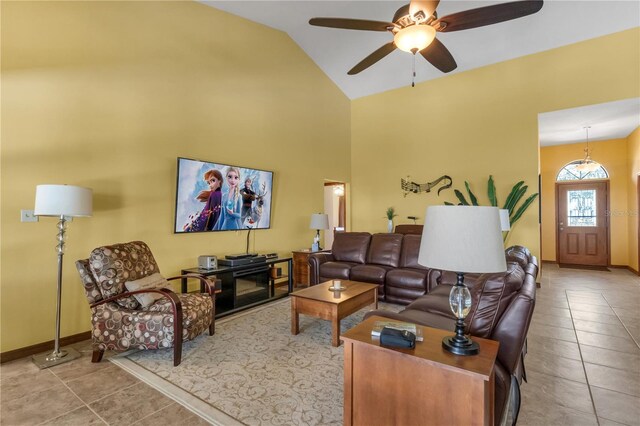 2825 Lake Tohopekaliga Blvd, Kissimmee, FL 34746 - tiled living area featuring a ceiling fan, baseboards, and high vaulted ceiling