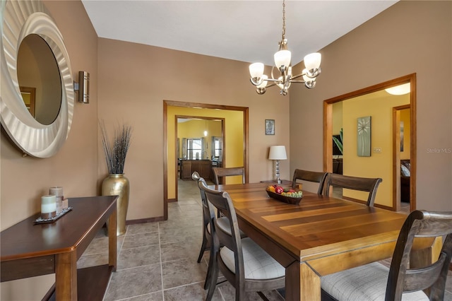 2825 Lake Tohopekaliga Blvd, Kissimmee, FL 34746 - dining area with baseboards and an inviting chandelier