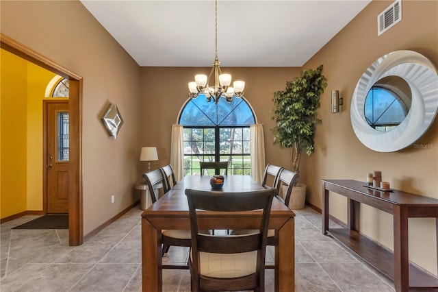2825 Lake Tohopekaliga Blvd, Kissimmee, FL 34746 - dining space featuring baseboards, visible vents, a notable chandelier, and light tile patterned floors