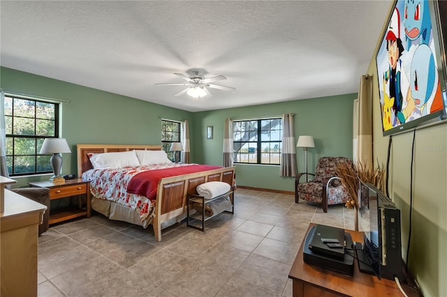 2825 Lake Tohopekaliga Blvd, Kissimmee, FL 34746 - bedroom featuring ceiling fan, baseboards, and tile patterned floors