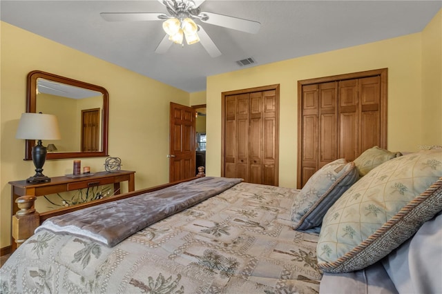 2825 Lake Tohopekaliga Blvd, Kissimmee, FL 34746 - bedroom with two closets, visible vents, and a ceiling fan