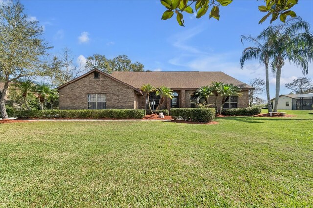 2825 Lake Tohopekaliga Blvd, Kissimmee, FL 34746 - single story home featuring a front lawn and brick siding