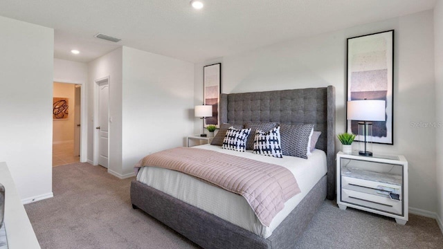 bedroom with carpet floors, recessed lighting, visible vents, and baseboards