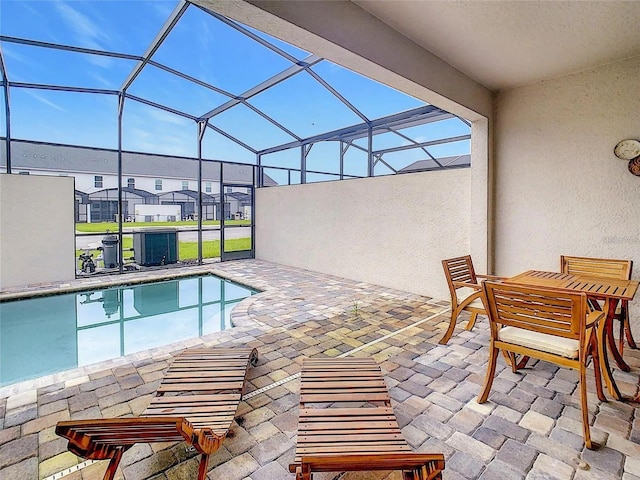 pool featuring a lanai and a patio