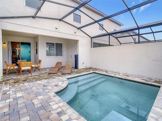 view of swimming pool featuring a patio area, a lanai, and a pool