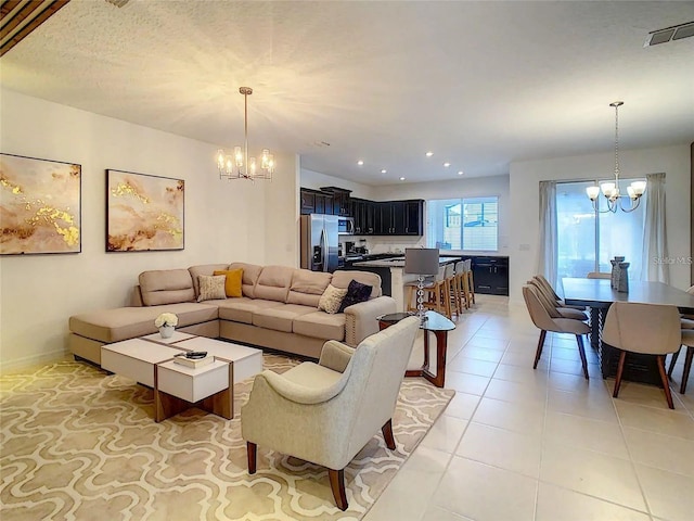 living room featuring light tile patterned floors, recessed lighting, visible vents, an inviting chandelier, and baseboards