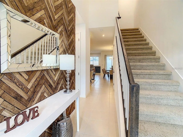 stairway with tile patterned flooring