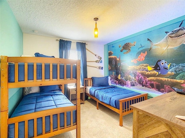 bedroom with carpet flooring and a textured ceiling