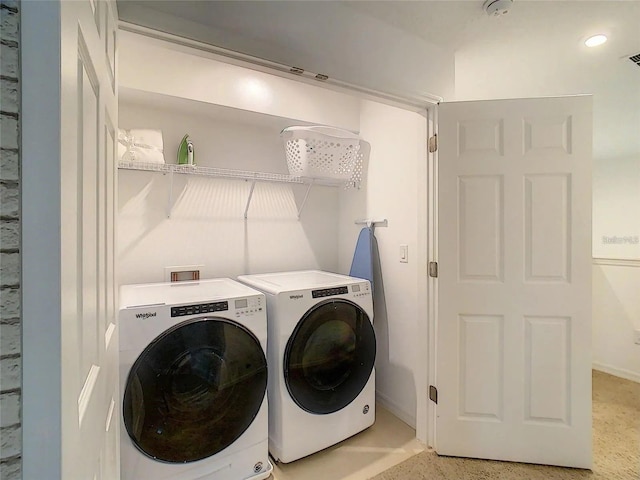 clothes washing area featuring laundry area, visible vents, and separate washer and dryer