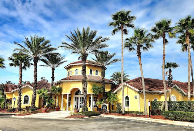 view of property with uncovered parking