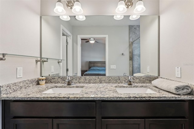 full bath featuring ensuite bathroom, a sink, and a chandelier