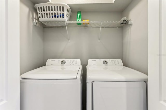 laundry area with washing machine and dryer and laundry area