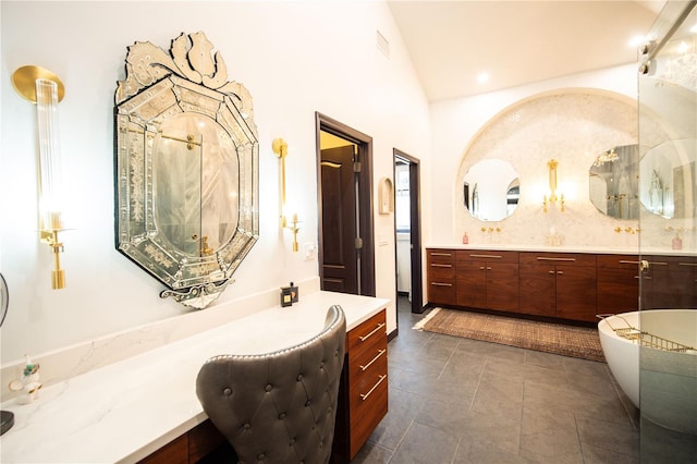 full bath featuring vaulted ceiling and vanity