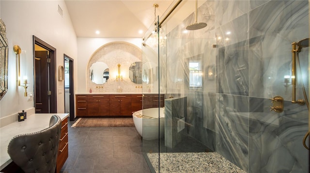 bathroom featuring visible vents, a stall shower, lofted ceiling, and vanity