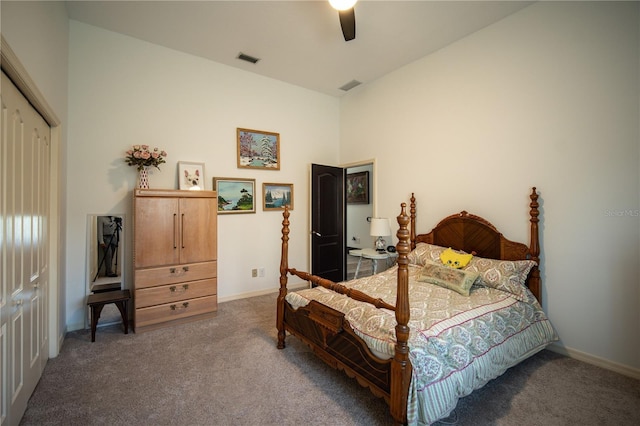 carpeted bedroom featuring baseboards, visible vents, and a ceiling fan