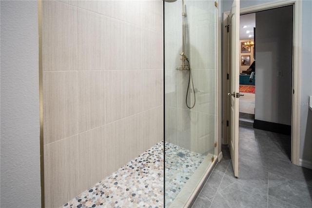 bathroom with ensuite bath, a walk in shower, and tile patterned floors