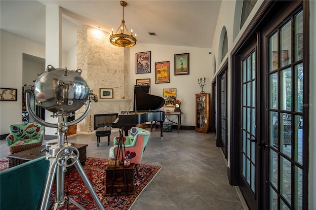 interior space featuring french doors, baseboards, lofted ceiling, a notable chandelier, and visible vents