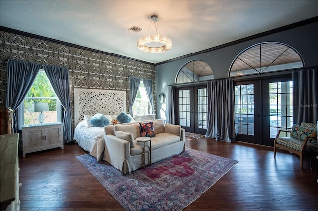 bedroom with visible vents, french doors, crown molding, hardwood / wood-style flooring, and access to outside