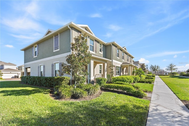 view of side of property with a residential view, a lawn, and stucco siding