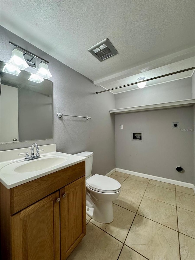 bathroom with toilet, visible vents, a textured ceiling, and vanity