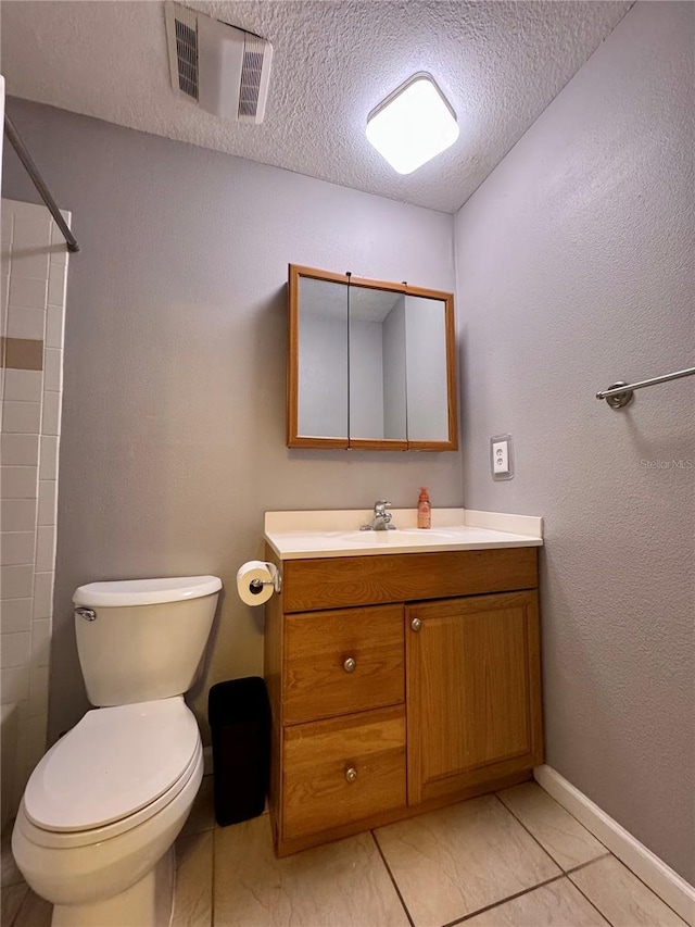 bathroom featuring toilet, a textured ceiling, vanity, and visible vents