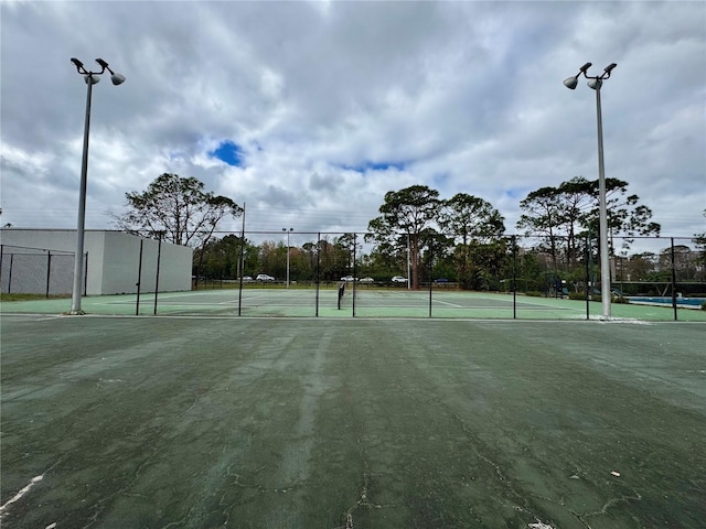 view of sport court with fence