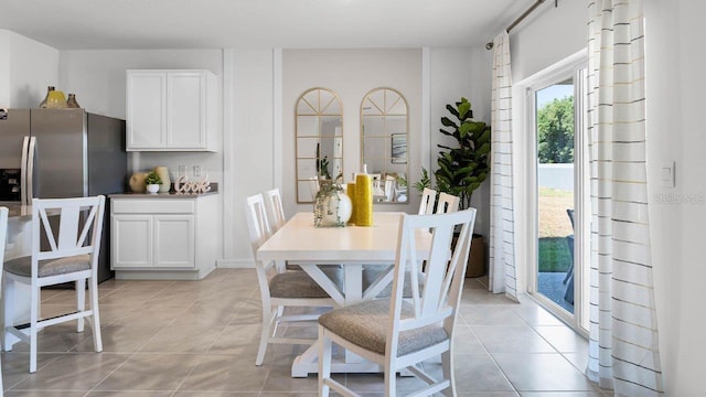 dining area featuring light tile patterned floors